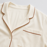 Ivory rose-piped cotton short set fabric and construction detailing