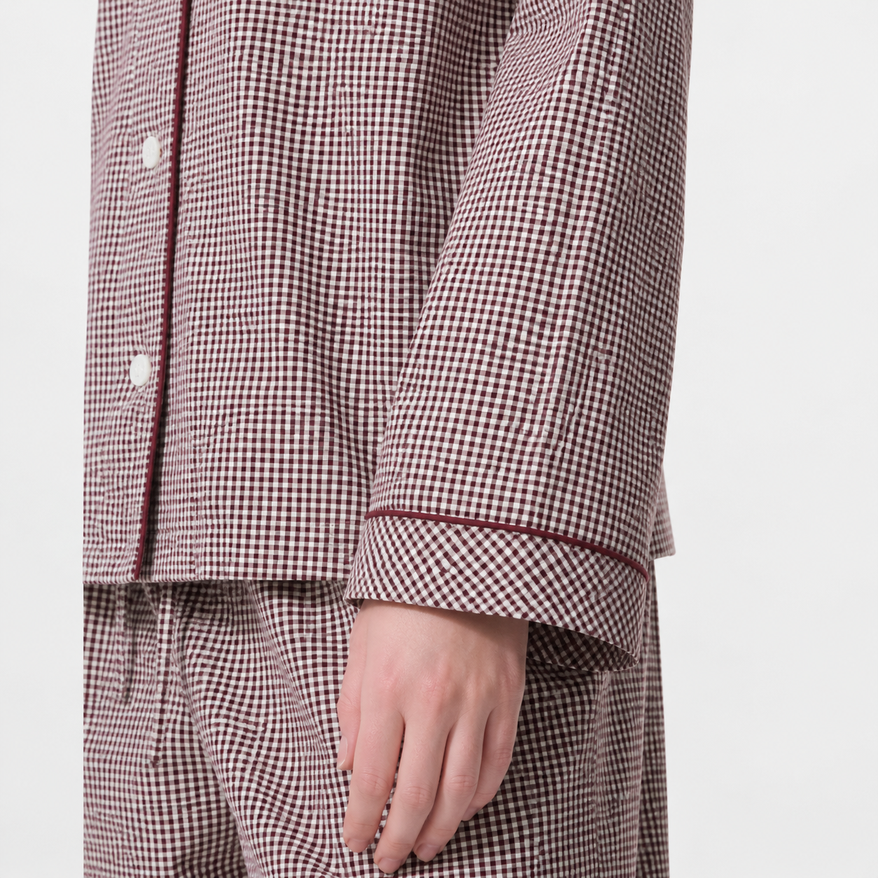 Organic cotton pajama shirt sleeve cuff with burgundy contrast piping