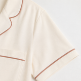 Ivory rose-piped cotton short set sleeve closure detail