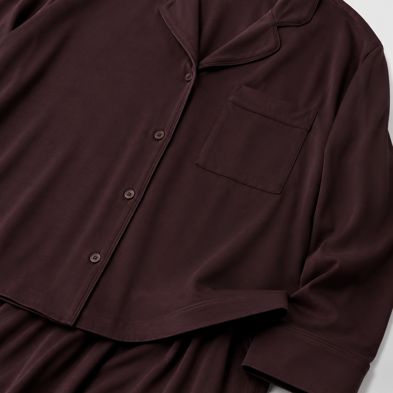 Deep burgundy pajama set fabric and pocket detailing