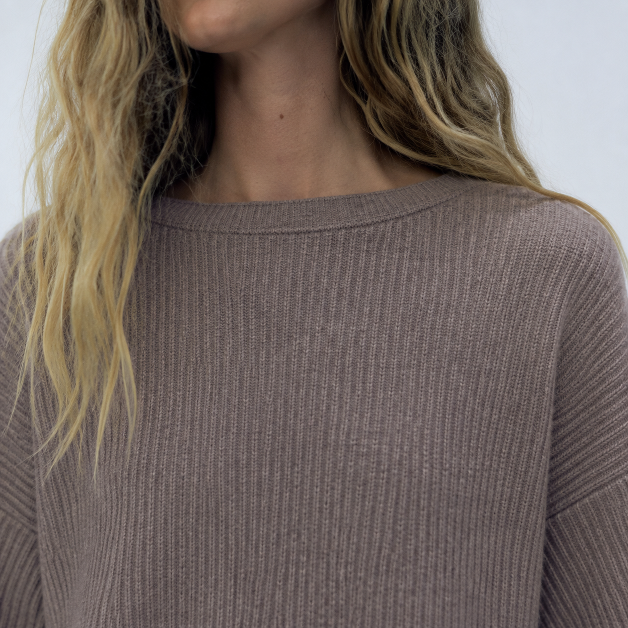 Taupe woolen sweater neckline close-up